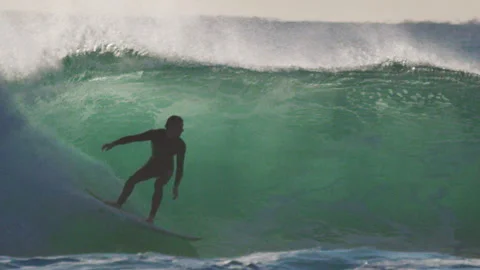 A man surfing inside a big wave Stock Footage 264076813
