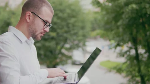 Man surfing the internet outdoors Stock Footage 159903448