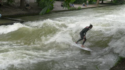 Man surfing on Isar River in Munich Stock Footage 54257701