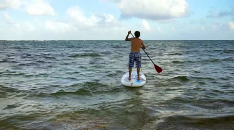 Man surfing  on paddle board Stock Footage 47784705