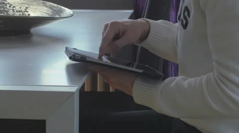 Man surfing on a tablet Stock Footage 61273993