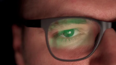 A man surfs the Internet, a close-up of glasses. Stock Footage 127760384
