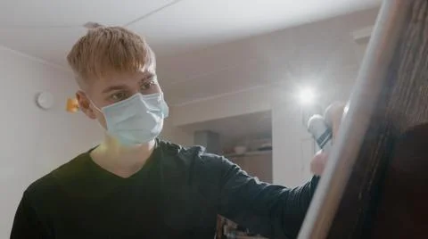 Man with Surgical Mask Using Marker to Write on Whiteboard Stock Photos