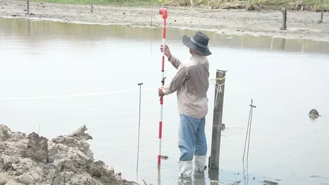 Man survey boundary of area Stock Footage 89642608