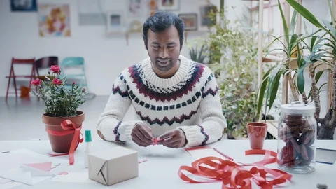 Man сut red paper heart for saint valentine show the love and smile to camera Stock Footage 101041085