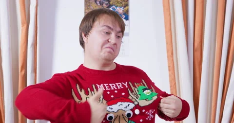 Man sweater deer gratefully joyfully shakes his head happy traditional gift Stock Footage 248104294