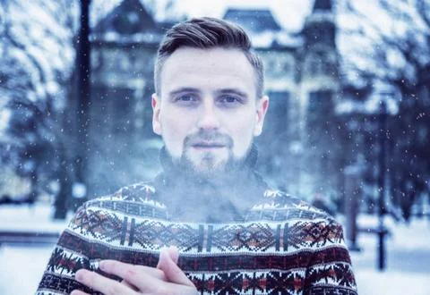 A man in a sweater at outside Stock Photos