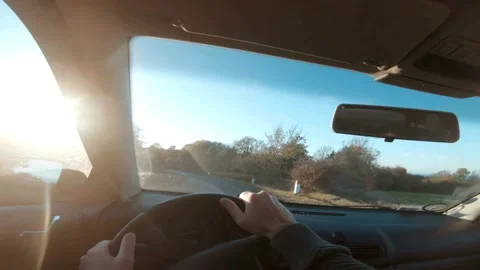 Man in sweater is sitting in the car behind the wheel. driver is driving the car Stock-Footage 336265534