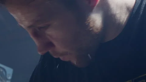 Man sweating heavily with forehead sweat during intense workout session Stock Footage 319988922