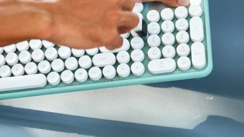 Man sweeping a dirty keyboard. Clean and maintain computers. Stock Footage 269903634