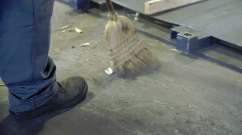A man is sweeping the floor Video stock 56054161