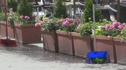Man sweeping in front of his restaurant Video stock 9140254