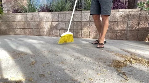 Man Sweeping Patio Видео 196762835