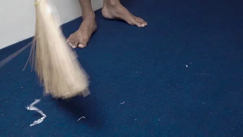 A man sweeps a blue carpet Stock Footage 328199770