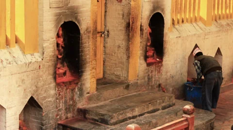 A man sweeps in a Hindu temple. Stock Footage 39836524