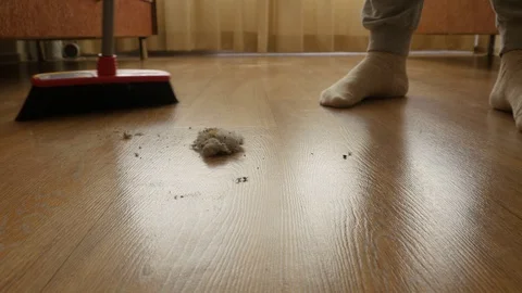 Man sweeps the room with a broom Stock-Footage 110826844