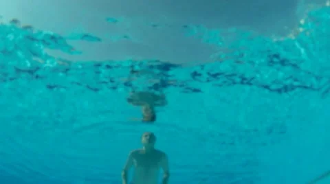 Man Swim and Dive under water into swimming pool Stock Footage 40089197