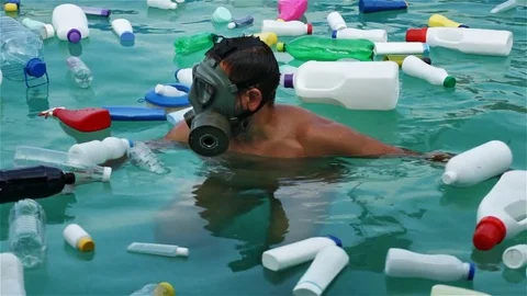 Man swim in polluted water using protecting mask Stock Footage 81118906