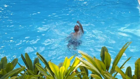 A man swim in the pool Stock Footage 122768265