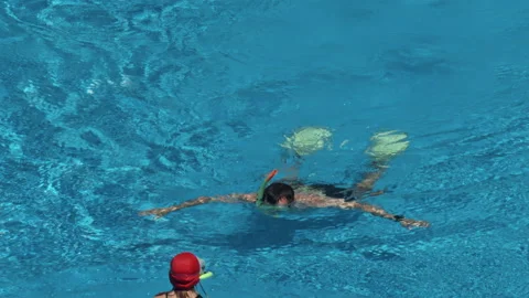 Man swim in the pool at the hotel Stock Footage 147457720
