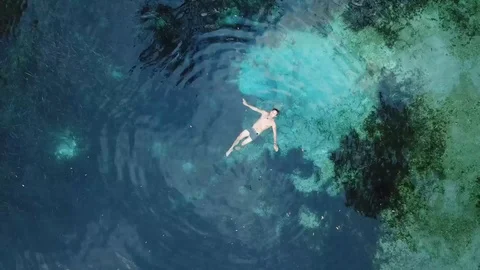Man Swimming in Clear Blue Florida Spring Drone Birds Eye Stock Footage 88962866