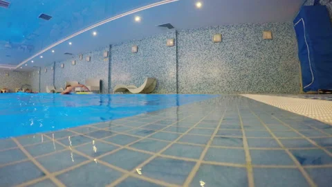 The man is swimming the crawl in the pool Stock Footage 106491690