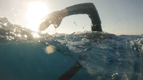 Man swimming forward crawl in sea, slow motion Stock Footage 199679218