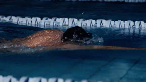Man swimming in front crawl stroke in a swimming pool Stock Footage 275263307