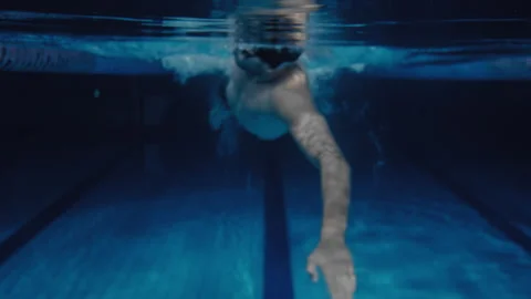 Man swimming front crawl style in a pool POV underwater Stock Footage 275265791