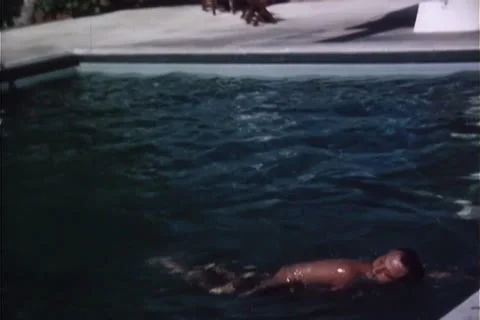 Man Swimming in Hotel Pool  circa 1960 Stock Footage 24752720