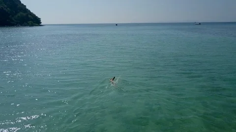 Man Swimming in Ocean Overhead 4K Stock Footage