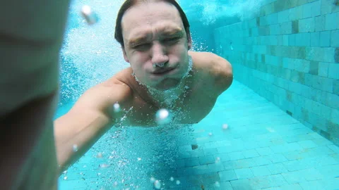 Man is swimming in the pool with action camera. Stock Footage 289704229