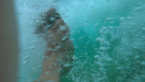 Man is swimming in the pool with action camera. Stock Footage 289709214