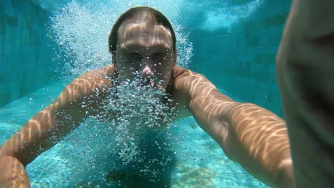 Man is swimming in the pool with action camera. Stock Footage 289712247