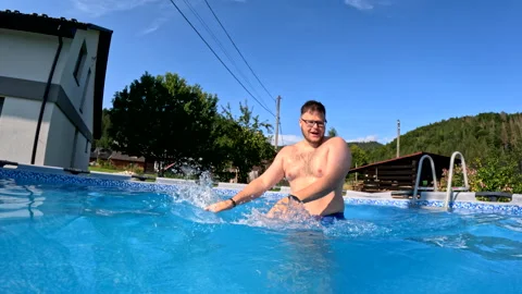 Man swimming in the pool at backyard Video stock 257411935