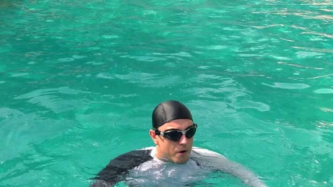 Man swimming in the pool Stock Footage 79888332