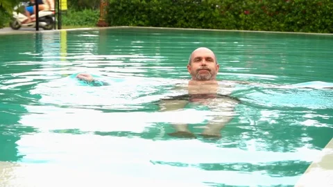 The man is swimming in the pool Video stock 94040188