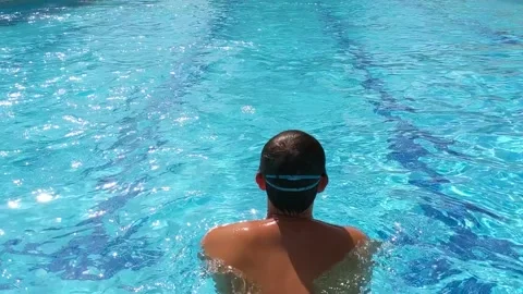 Man swimming in a pool Stock Footage 266888246