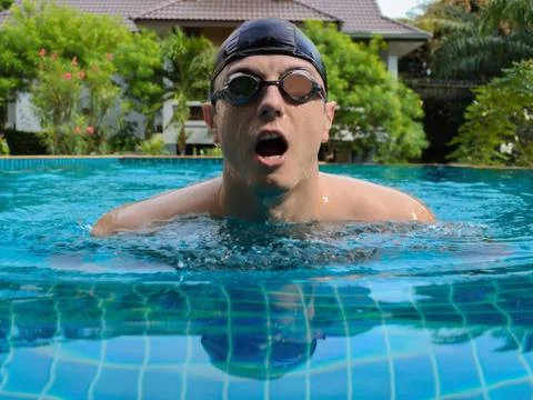 Man swimming in the pool Stock Photos