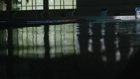 Man is swimming in the pool in the water Stock Footage 132895850