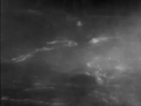 Man swimming in river during rain storm, 1930s 動画素材 65860880