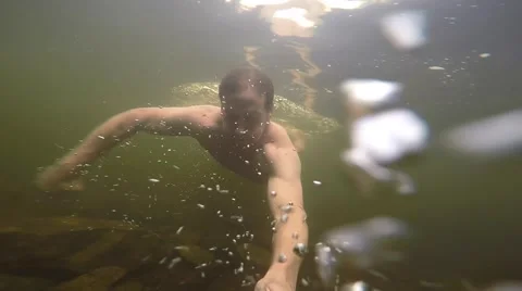 Man swimming in stream slow motion Stock Footage 50941701