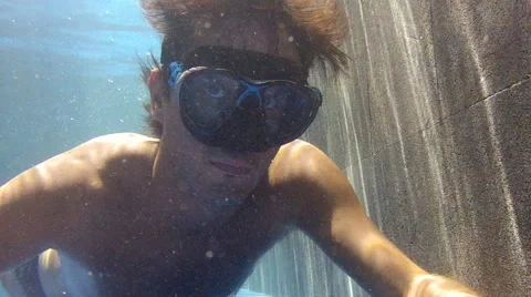 Man swimming underwater in pool Stock Footage 59539477