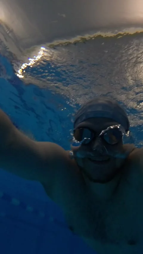 Man swimming underwater in the pool Stock Footage 263022656
