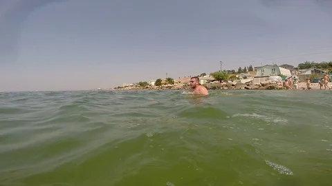 Man swims breaststroke Stock Footage 71359943