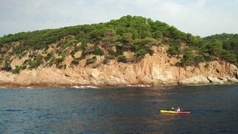 A man swims in a kayak Stock Footage 171424432