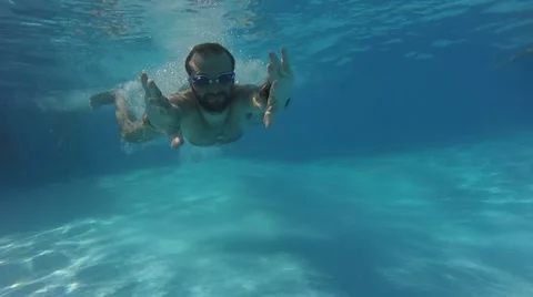 A man swims under water Stock Footage 68924254