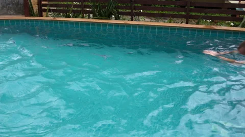 Men and women relaxing in poolside - a Royalty Free Stock Photo from  Photocase