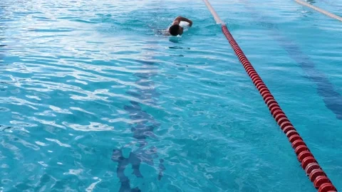 A man swims underwater in a pool. Stock Footage 237780111