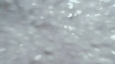 A man swims on the waves of the sea on an inflatable circle Stock Footage 162516672